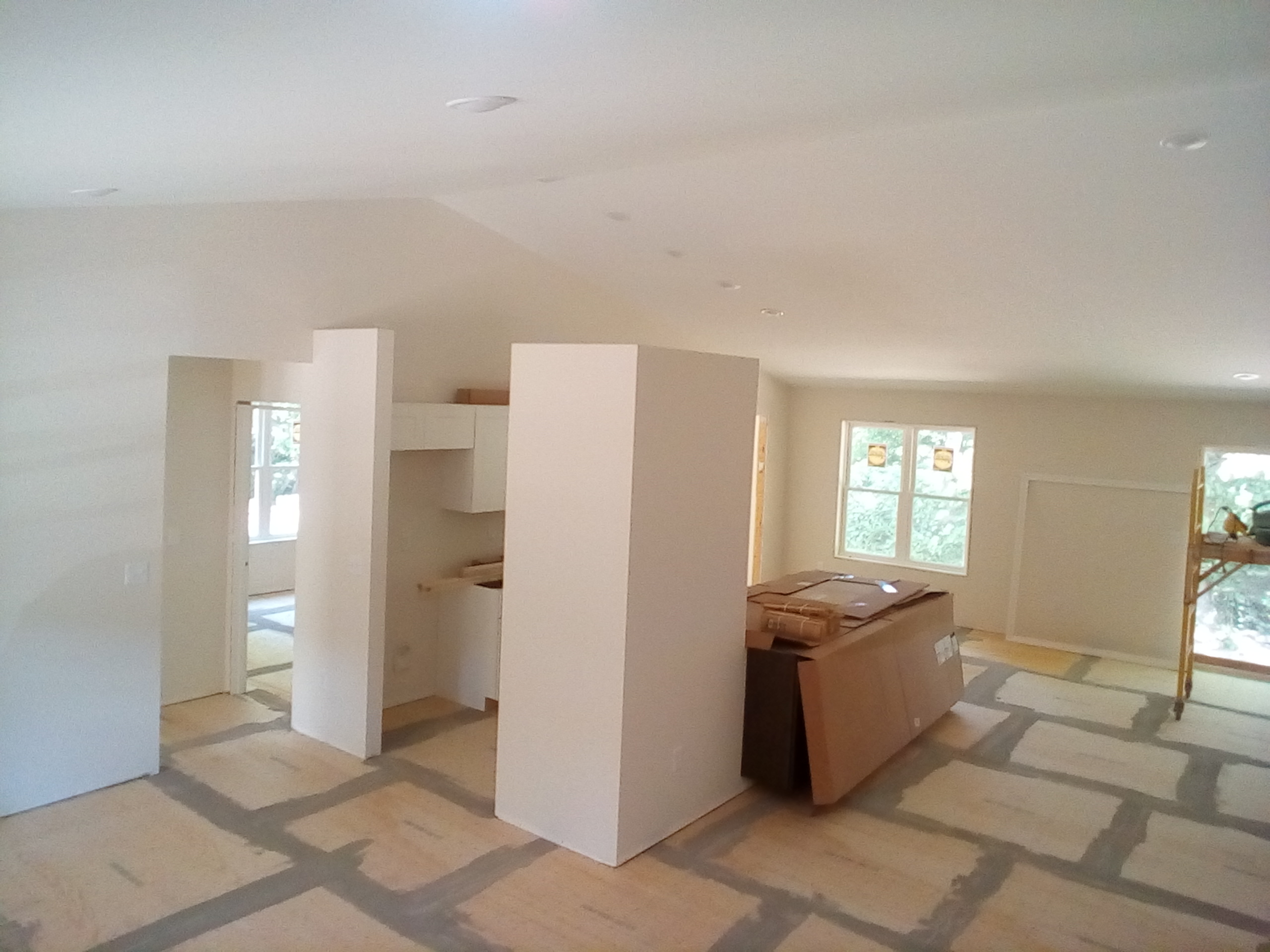 Unfinished room with drywall and natural light.