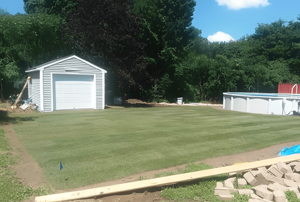 Garage and pool in spacious backyard.