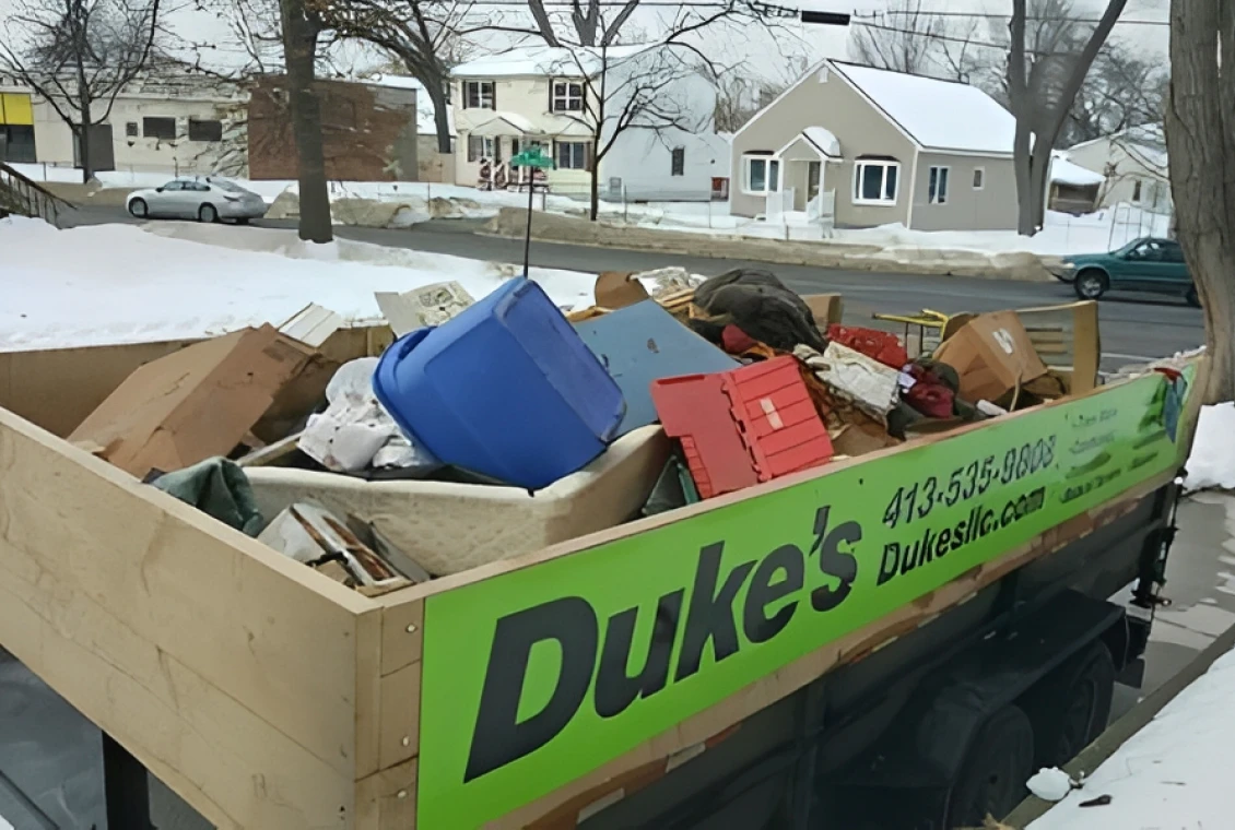 Truck loaded with assorted junk and debris.